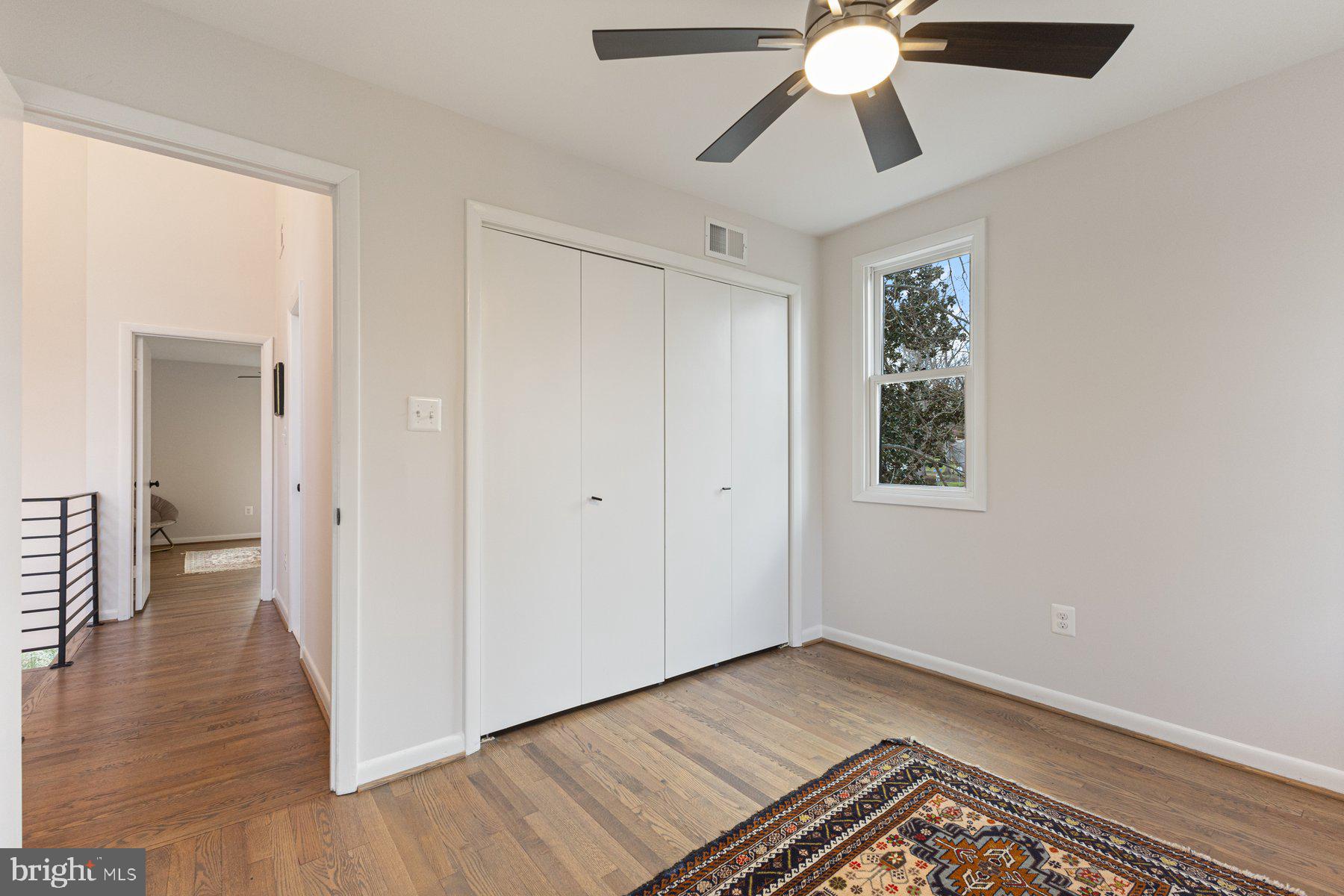 1875 Massachusetts Avenue McLean, VA 22101 - Photo 42 of 52 a view of an empty room with wooden floor and a window