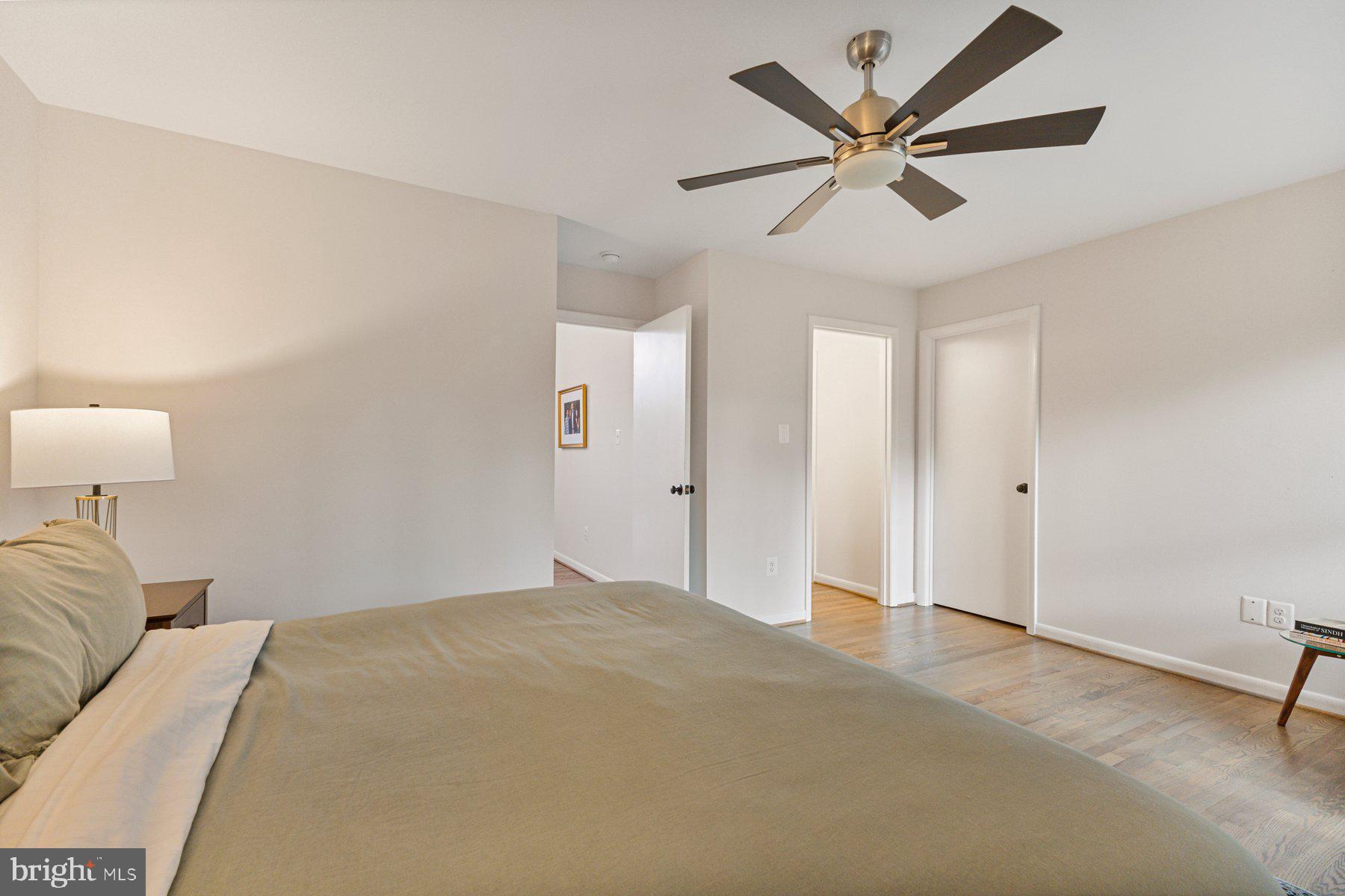 1875 Massachusetts Avenue McLean, VA 22101 - Photo 47 of 52 a bedroom with a large bed chandelier and a window