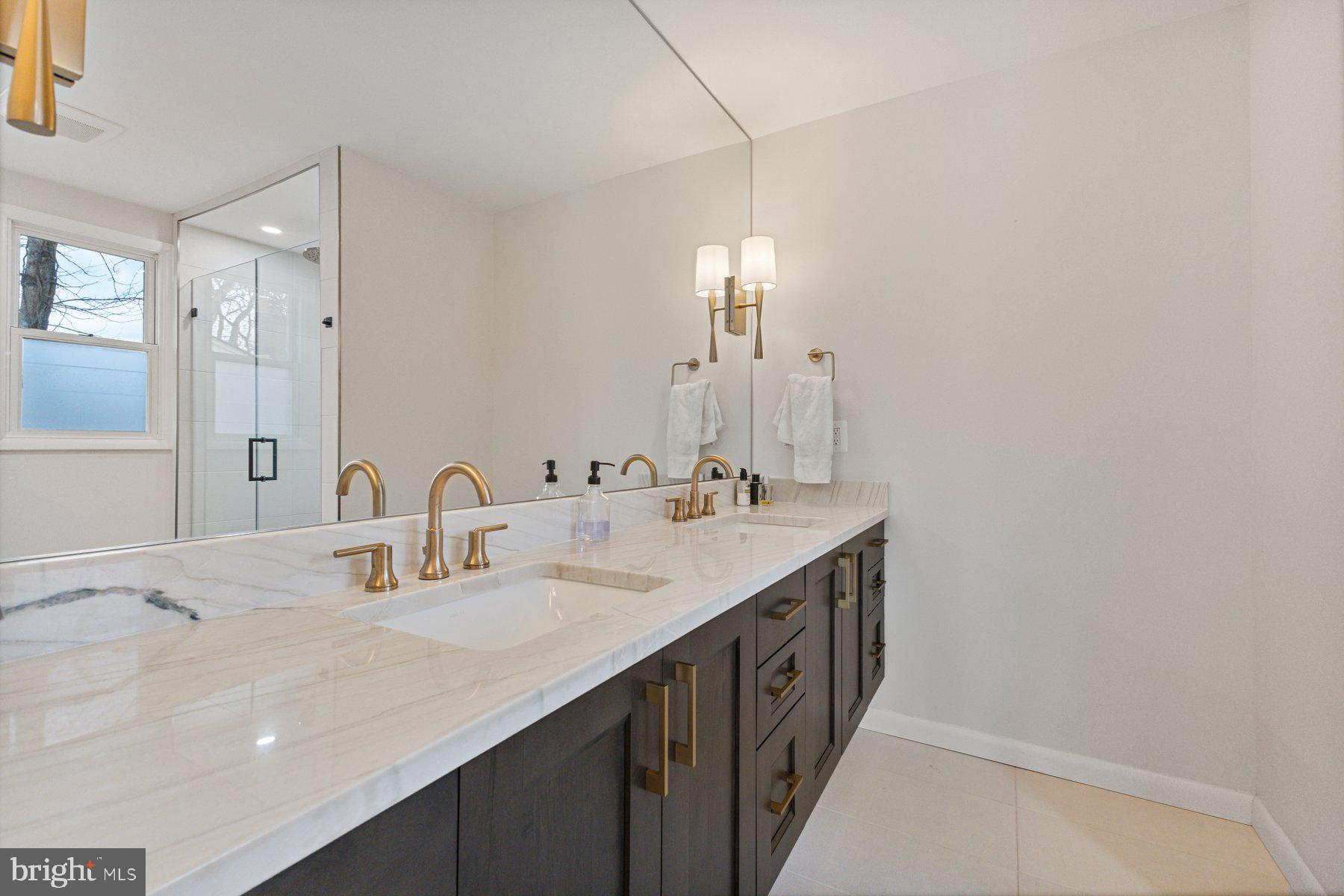 1875 Massachusetts Avenue McLean, VA 22101 - Photo 50 of 52 a bathroom with double sink and a mirror