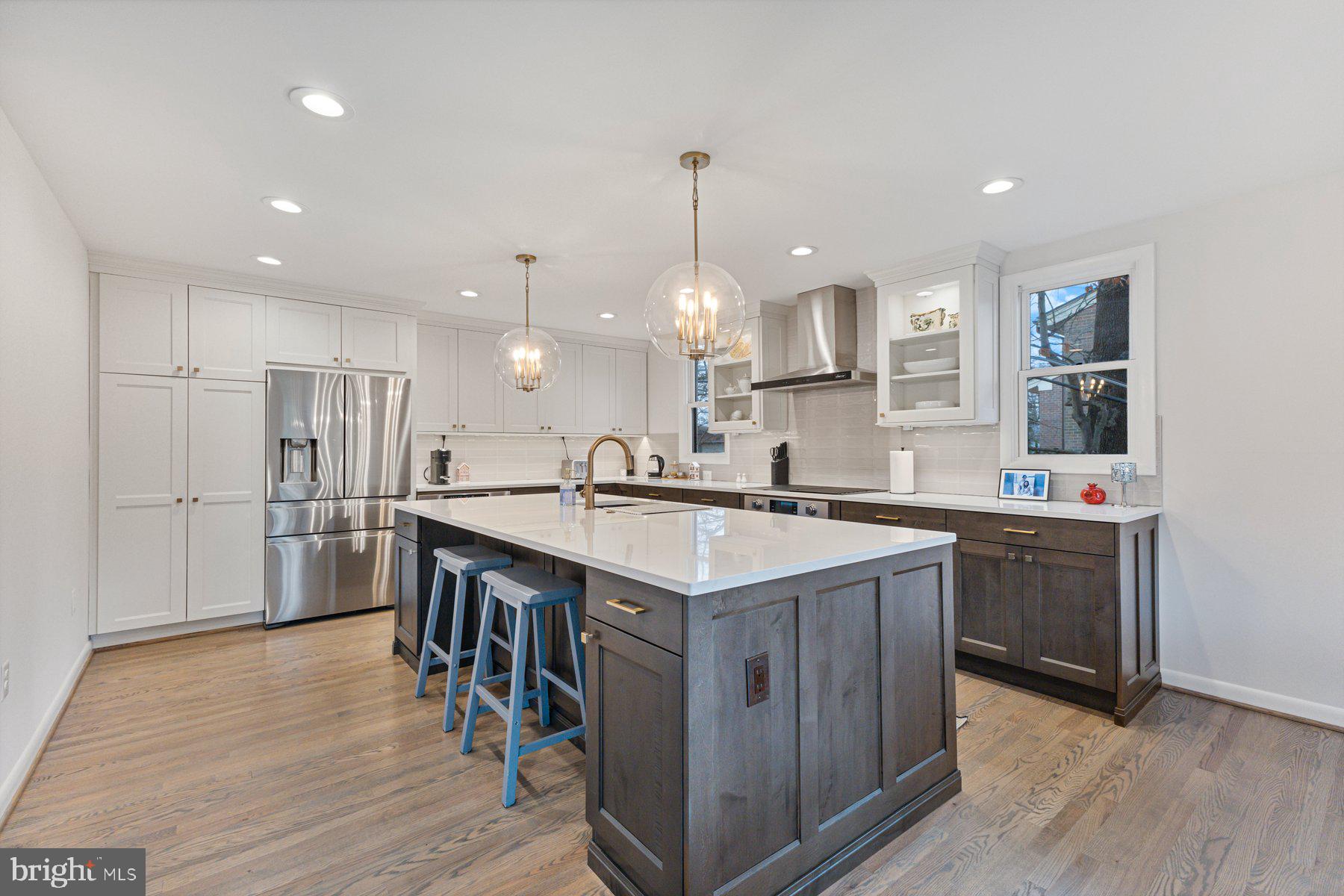 1875 Massachusetts Avenue McLean, VA 22101 - Photo 9 of 52 a kitchen with kitchen island a sink appliances and cabinets