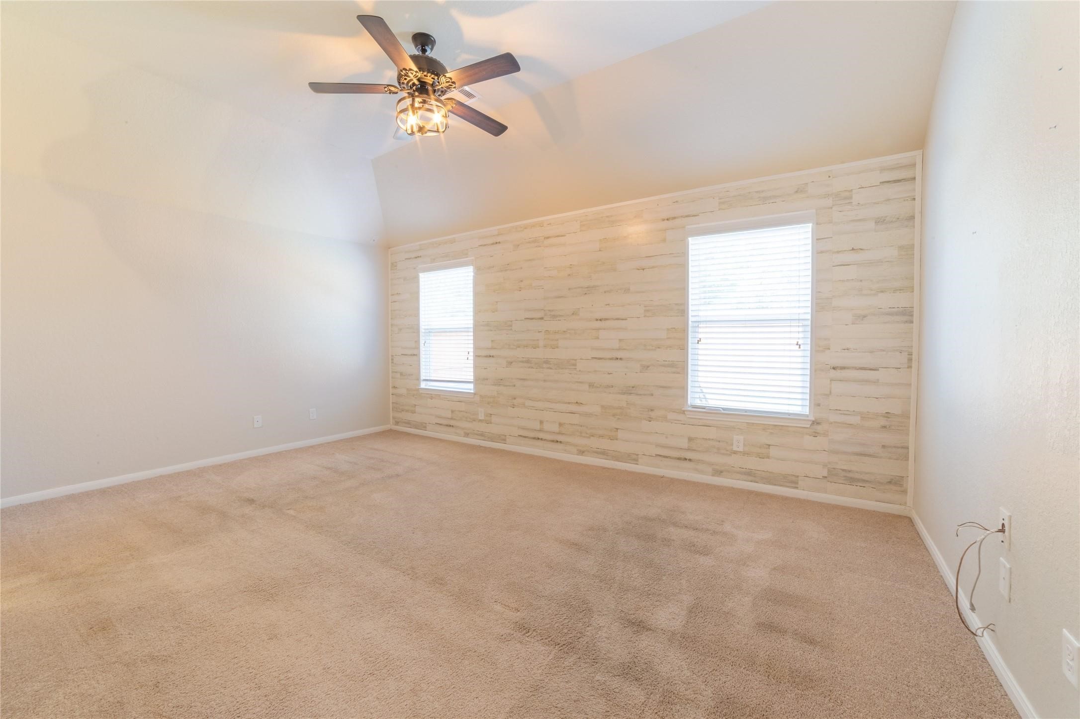10510 Chestnut Path Way Tomball, TX 77375 - Photo 8 of 18 Spacious primary bedroom with designer shiplap wall