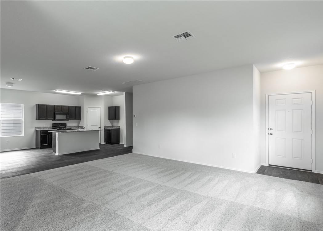 15204 Kent Justin Austin, TX 78725 - Photo 2 of 22 a view of kitchen with refrigerator and chairs