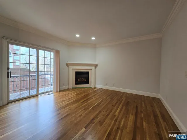 wooden floor in an empty room with a fireplace