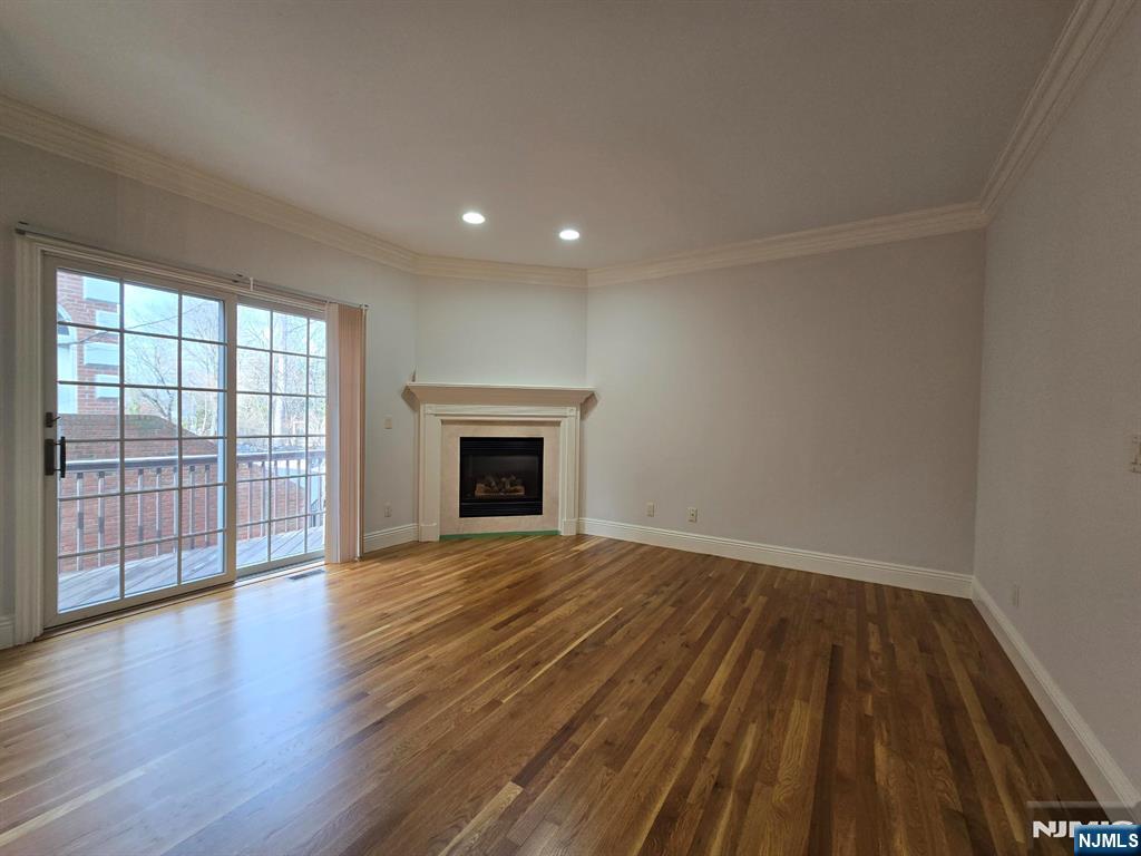 139 Stonegate Trail, Unit 40 Cresskill, NJ 07626 - Photo 11 of 23 wooden floor in an empty room with a fireplace