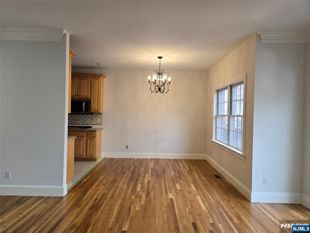 139 Stonegate Trail, Unit 40 Cresskill, NJ 07626 - Photo 12 of 23 wooden floor in an empty room with a window