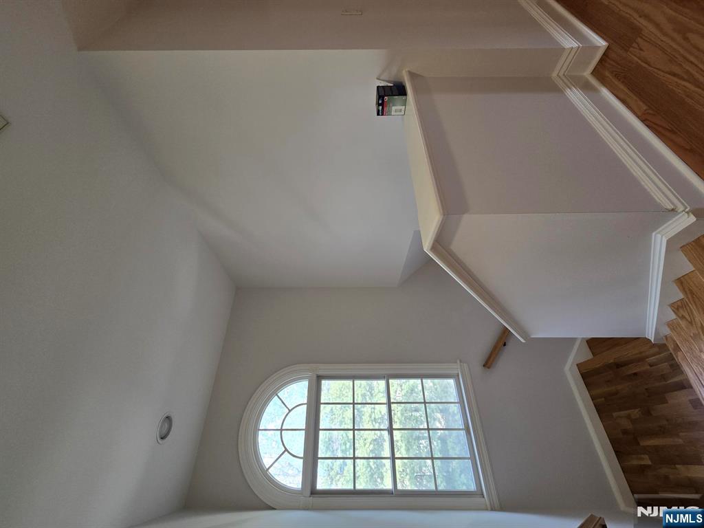 139 Stonegate Trail, Unit 40 Cresskill, NJ 07626 - Photo 14 of 23 a view of room with window and wooden floor