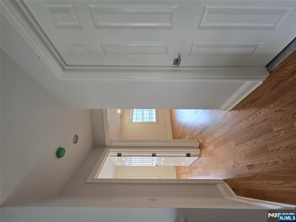 139 Stonegate Trail, Unit 40 Cresskill, NJ 07626 - Photo 20 of 23 a view of a hallway with wooden floor