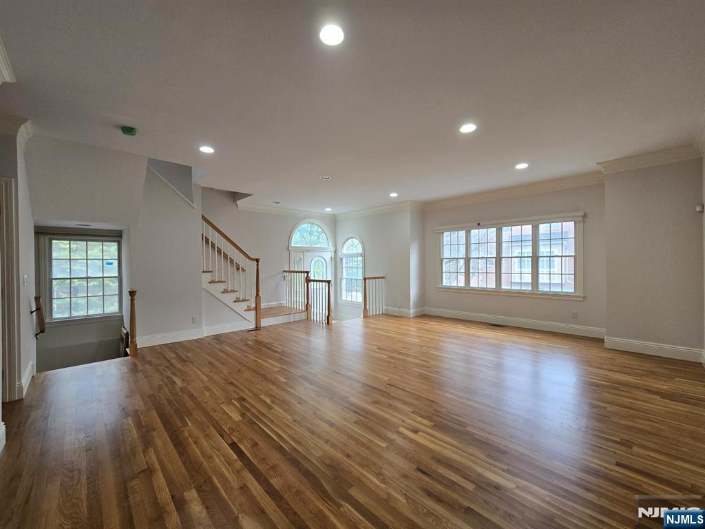 139 Stonegate Trail, Unit 40 Cresskill, NJ 07626 - Photo 2 of 23 a view of an empty room with wooden floor and a window