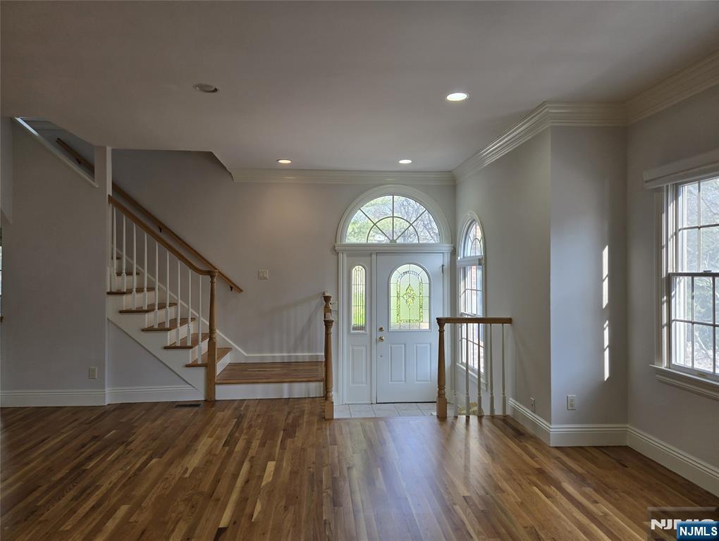 139 Stonegate Trail, Unit 40 Cresskill, NJ 07626 - Photo 3 of 23 a view of empty room with wooden floor and fan