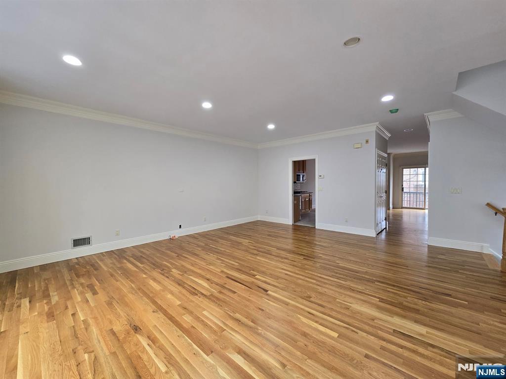 139 Stonegate Trail, Unit 40 Cresskill, NJ 07626 - Photo 4 of 23 a view of empty room with wooden floor