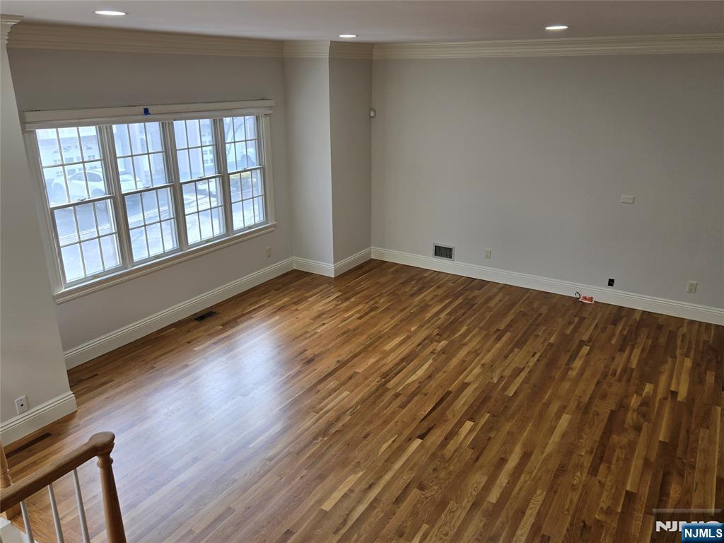139 Stonegate Trail, Unit 40 Cresskill, NJ 07626 - Photo 5 of 23 wooden floor in an empty room with a window