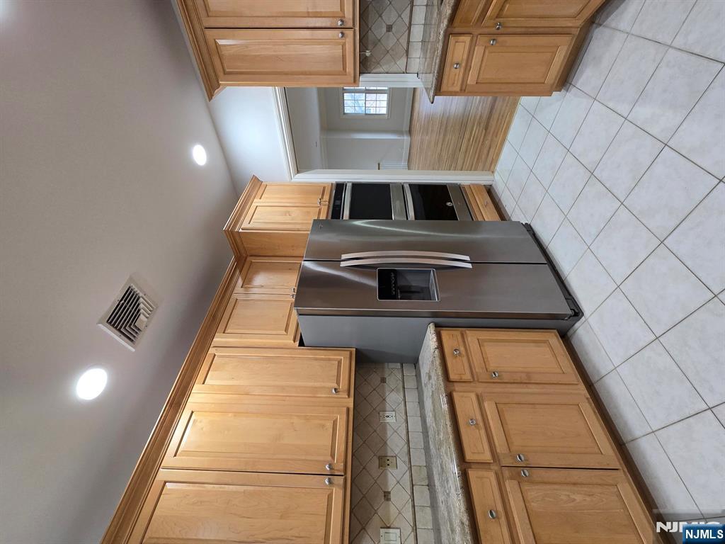 139 Stonegate Trail, Unit 40 Cresskill, NJ 07626 - Photo 9 of 23 a kitchen with stainless steel appliances granite countertop a refrigerator and a stove top oven