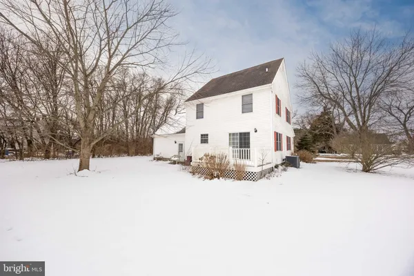 a view of a house covered in snow