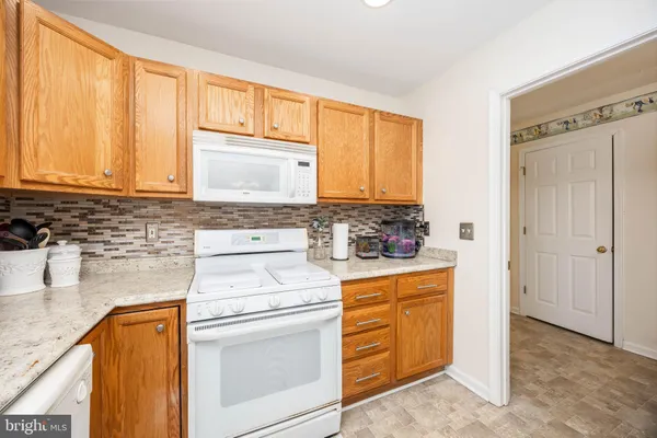 a view of a kitchen with washer and dryer