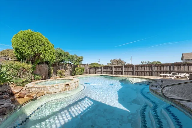 a view of a swimming pool and lounge chair
