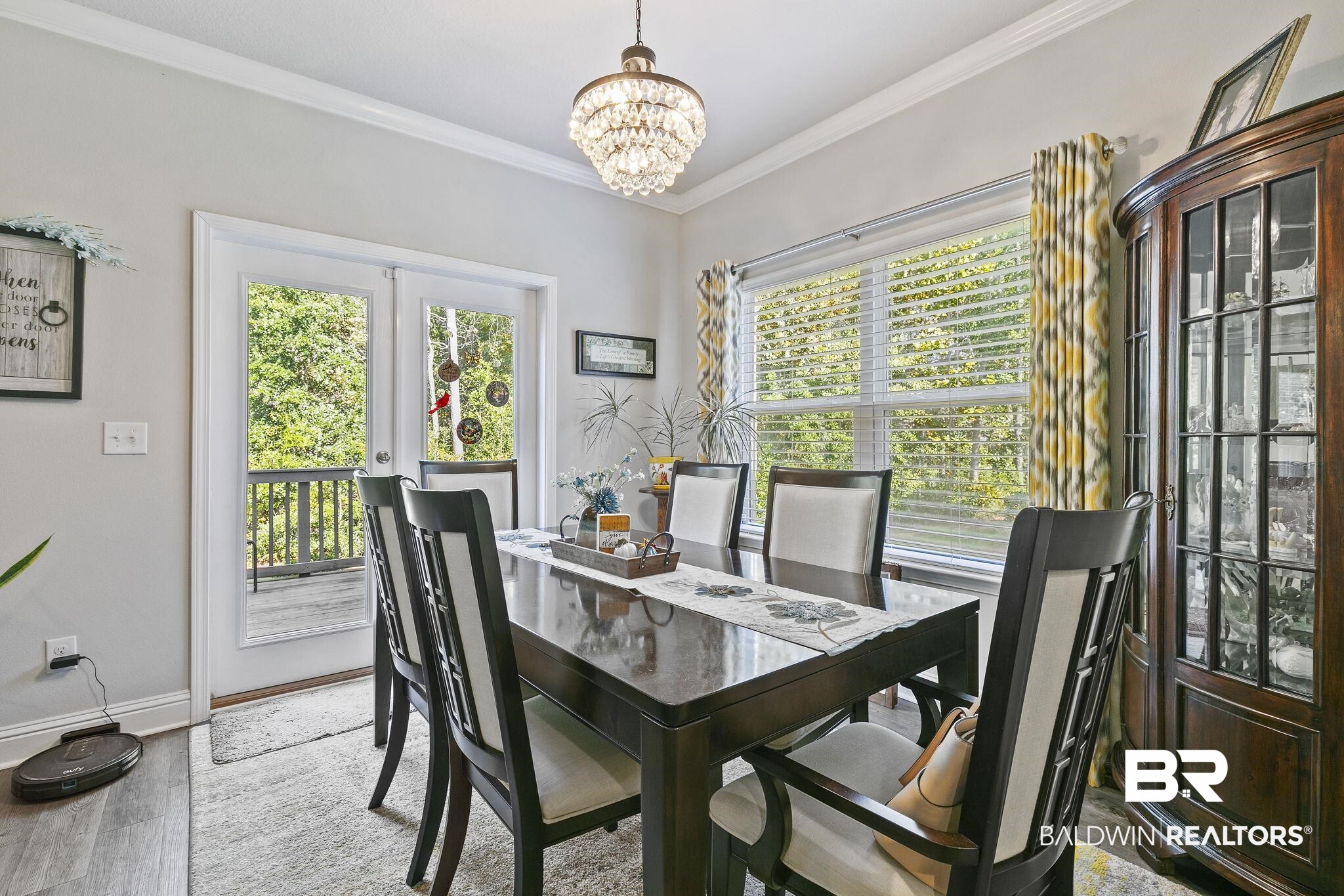 6867 Spaniel Drive, Unit B Daphne, AL 36527 - Photo 12 of 36 Dining area with a chandelier, crown molding, french doors, and wood-type flooring