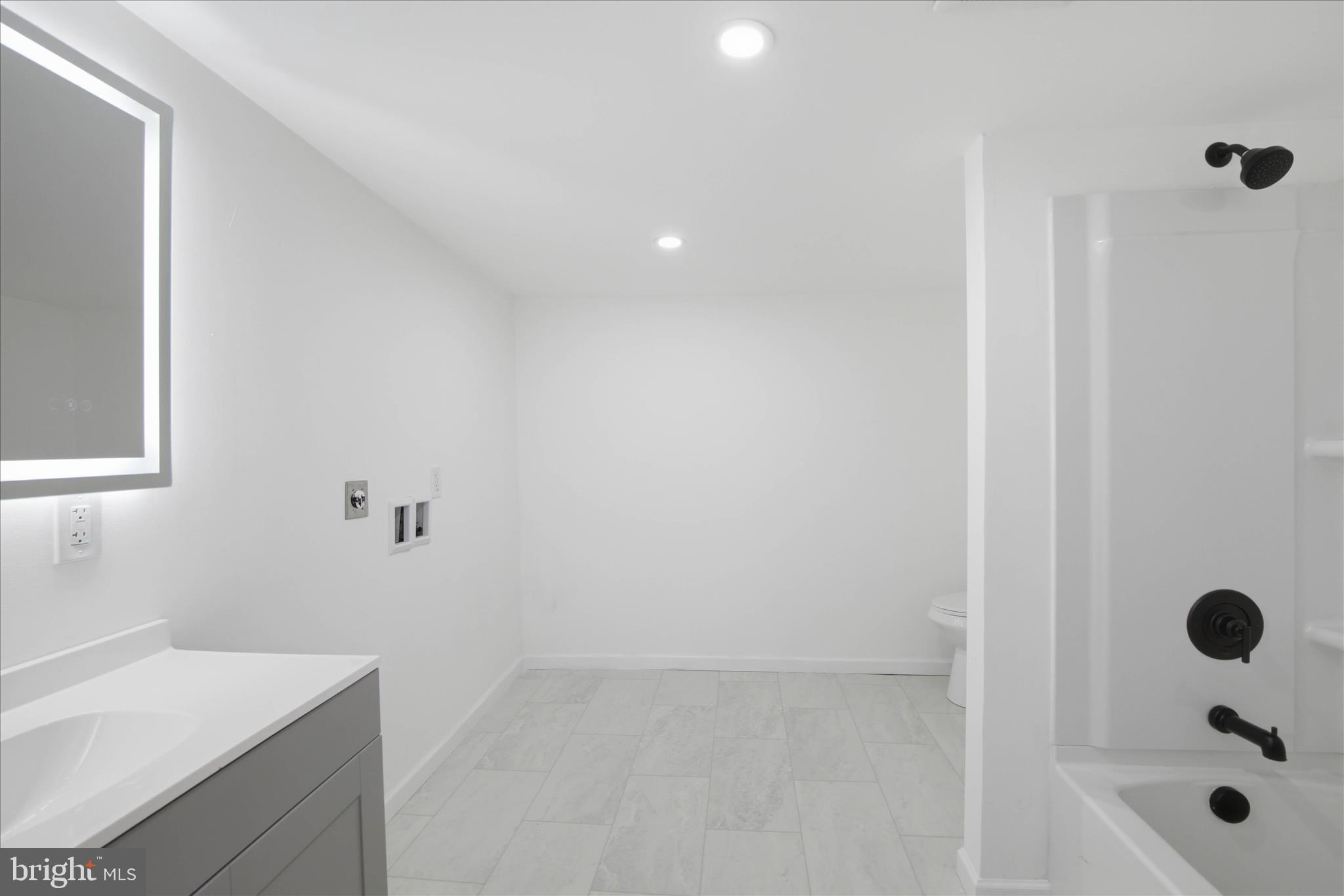 751 High Street Lancaster, PA 17603 - Photo 22 of 41 a bathroom with a sink a toilet and shower