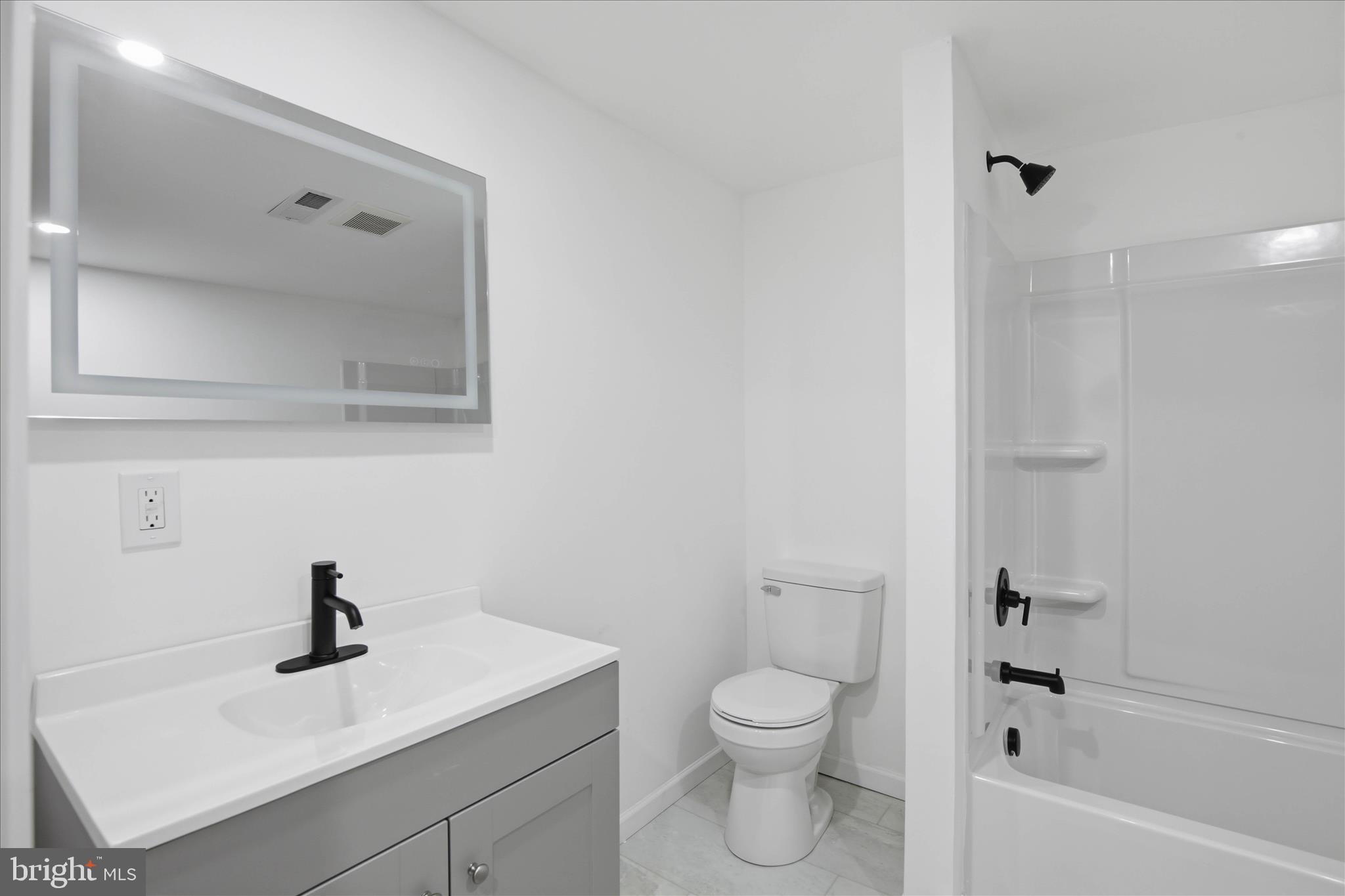 751 High Street Lancaster, PA 17603 - Photo 25 of 41 a bathroom with a sink a toilet and shower