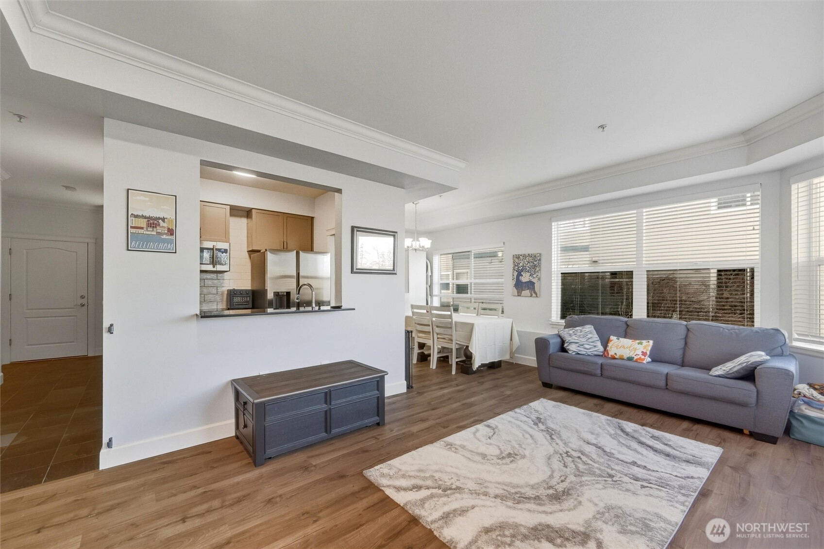 255 West Bakerview Road, Unit B103 Bellingham, WA 98226 - Photo 3 of 40 a living room with furniture and a wooden floor