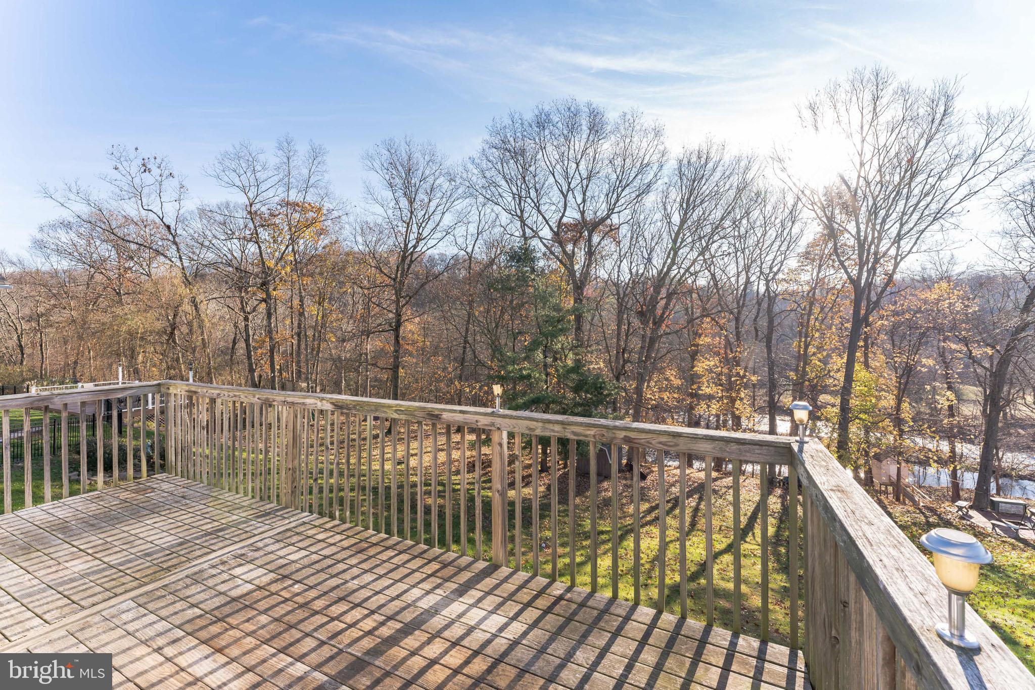 732 Raynham Road Collegeville, PA 19426 - Photo 4 of 23 Oversized Deck with Wooded Creek views