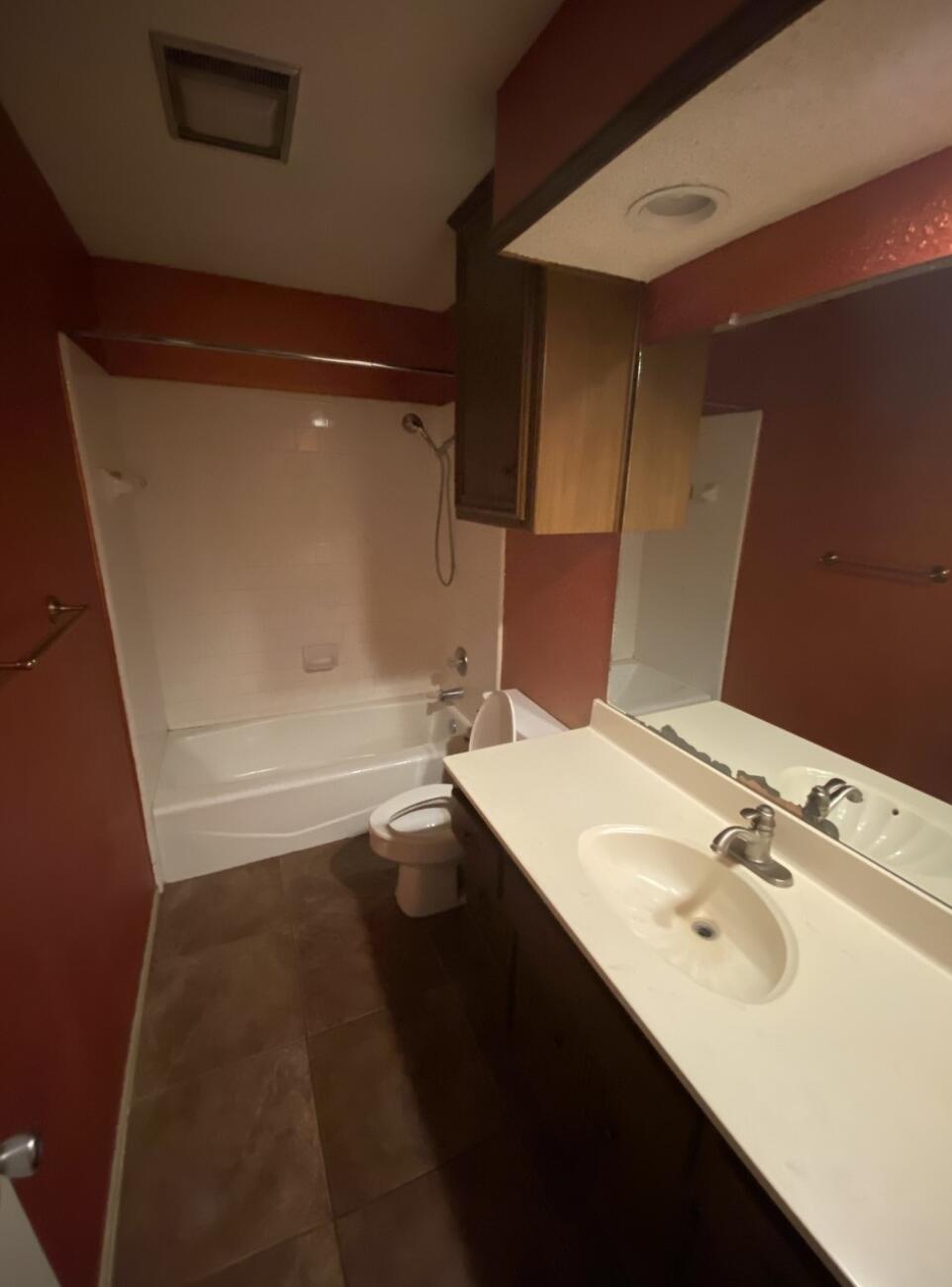 6818 Huron Avenue Lubbock, TX 79424 - Photo 7 of 11 a bathroom with a sink and a mirror