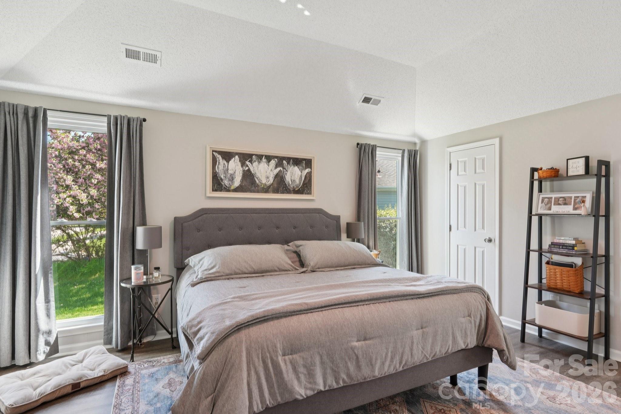 3661 Lake Spring Avenue Northwest Concord, NC 28027 - Photo 17 of 42 a bedroom with a large bed and a window