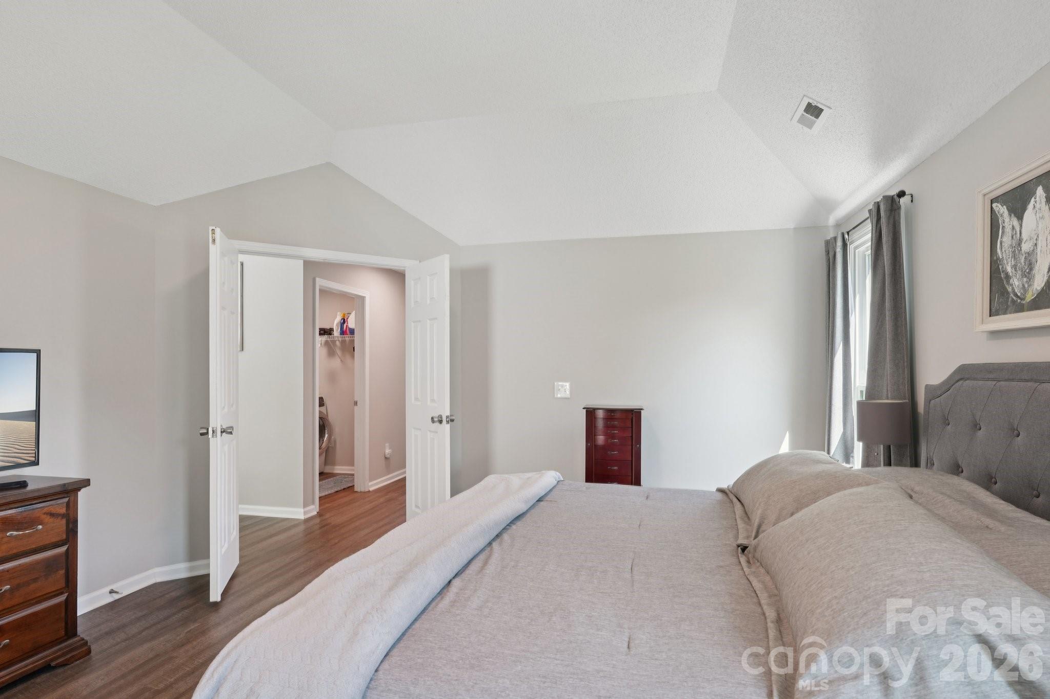 3661 Lake Spring Avenue Northwest Concord, NC 28027 - Photo 20 of 42 a bedroom with a bed and wooden floor