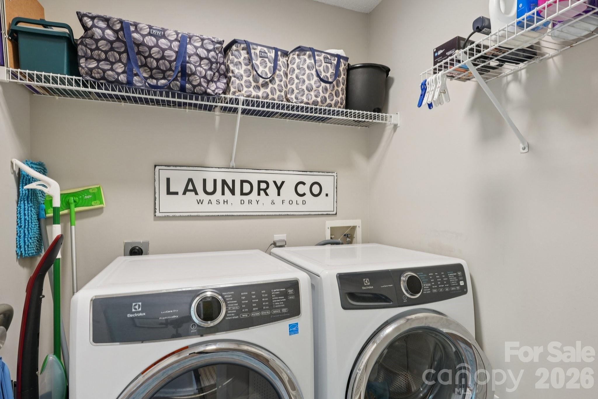 3661 Lake Spring Avenue Northwest Concord, NC 28027 - Photo 24 of 42 a utility room with dryer and washer