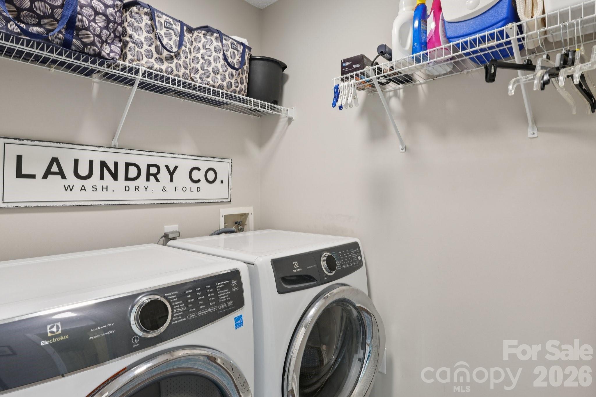 3661 Lake Spring Avenue Northwest Concord, NC 28027 - Photo 25 of 42 a utility room with dryer and washer