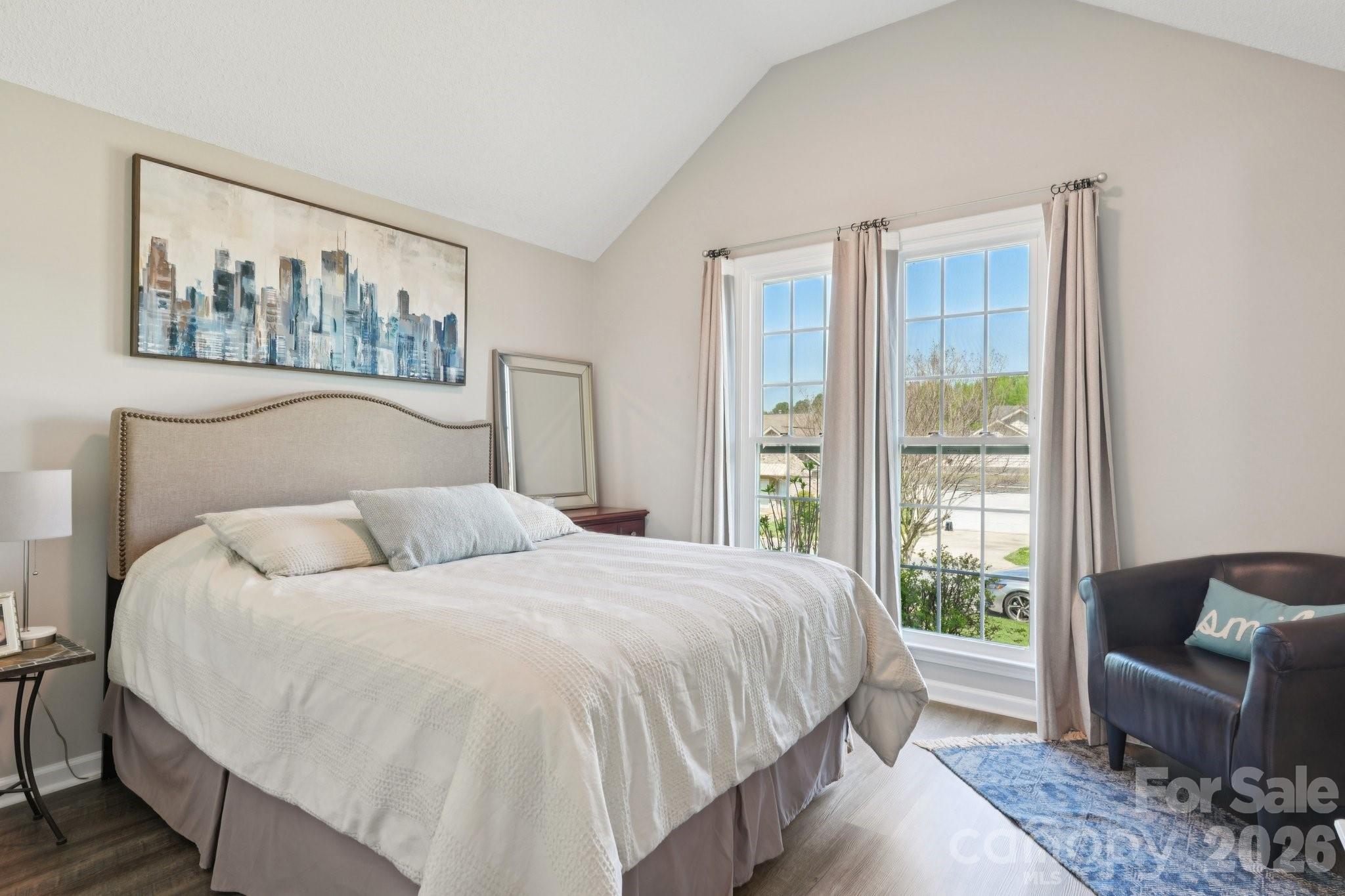 3661 Lake Spring Avenue Northwest Concord, NC 28027 - Photo 32 of 42 a bedroom with a large bed and a couch