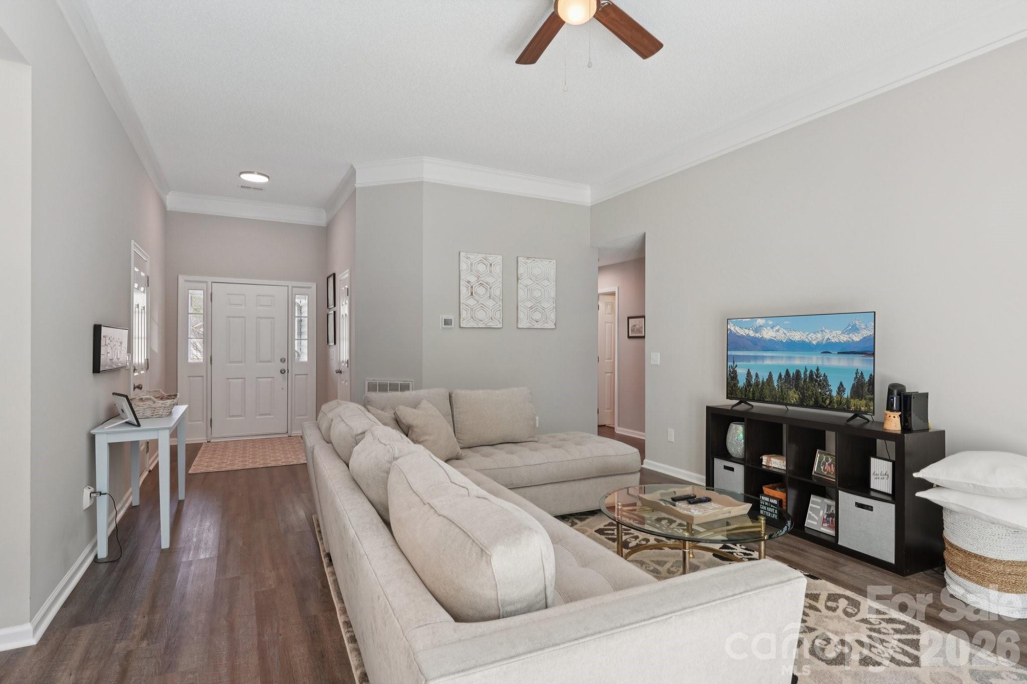 3661 Lake Spring Avenue Northwest Concord, NC 28027 - Photo 10 of 42 a living room with furniture and wooden floor
