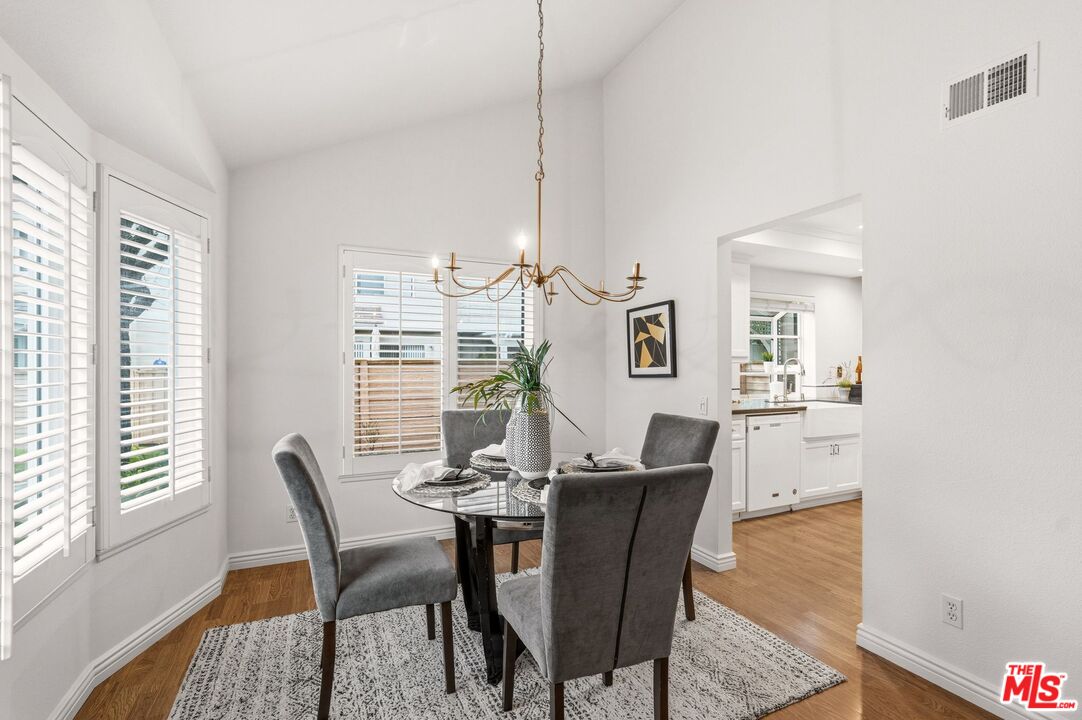23 Cresthaven, Unit 51 Irvine, CA 92604 - Photo 4 of 24 a view of a dining room with furniture window and wooden floor