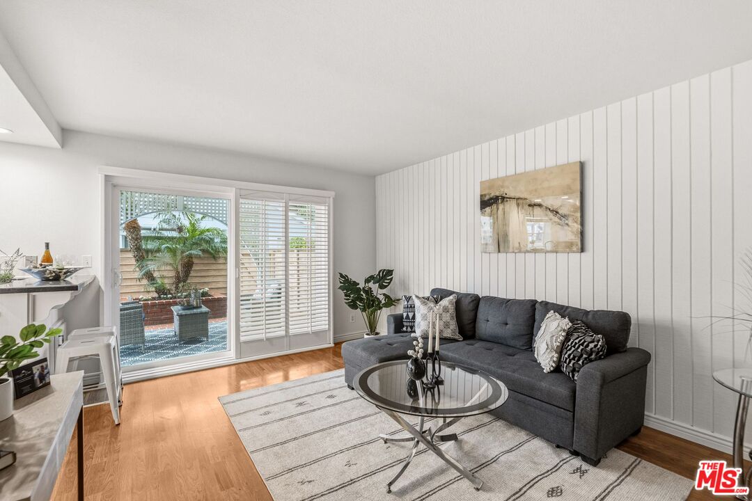 23 Cresthaven, Unit 51 Irvine, CA 92604 - Photo 7 of 24 a living room with furniture and wooden floor