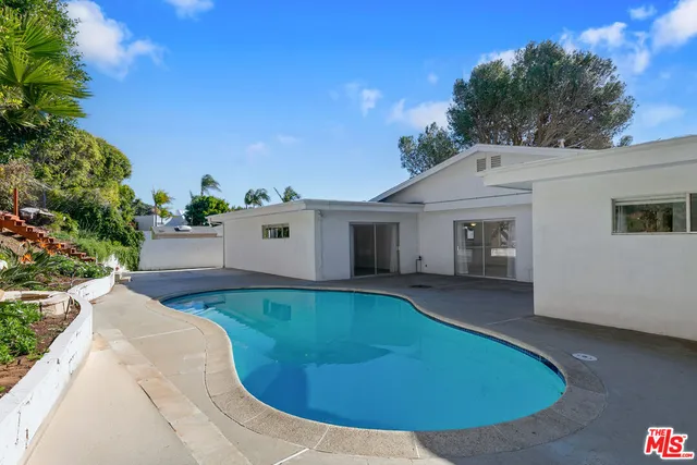 a view of a house with swimming pool