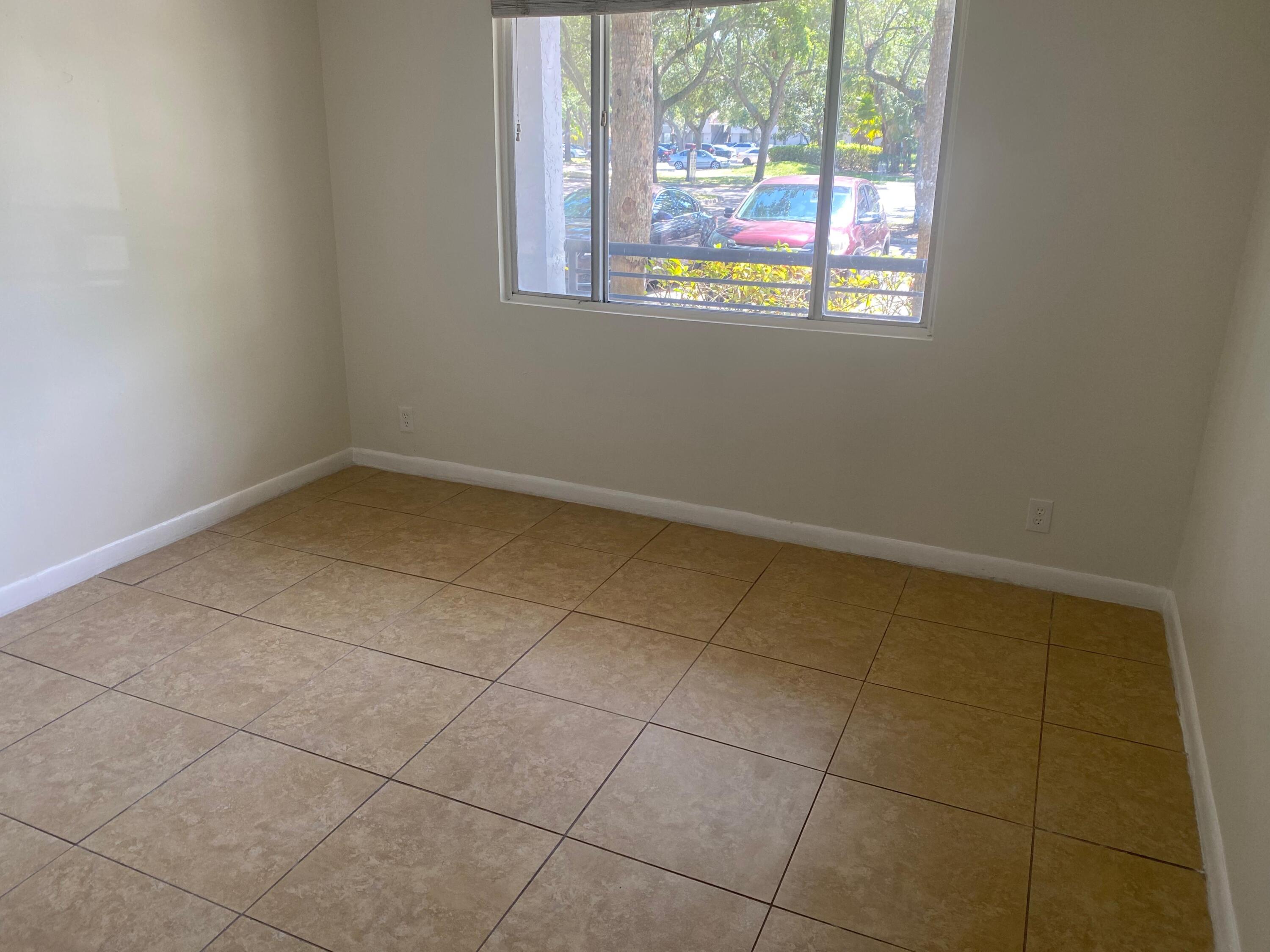 601 Lyons Road, Unit 7105 Coconut Creek, FL 33063 - Photo 11 of 13 a view of a room that has a window in it