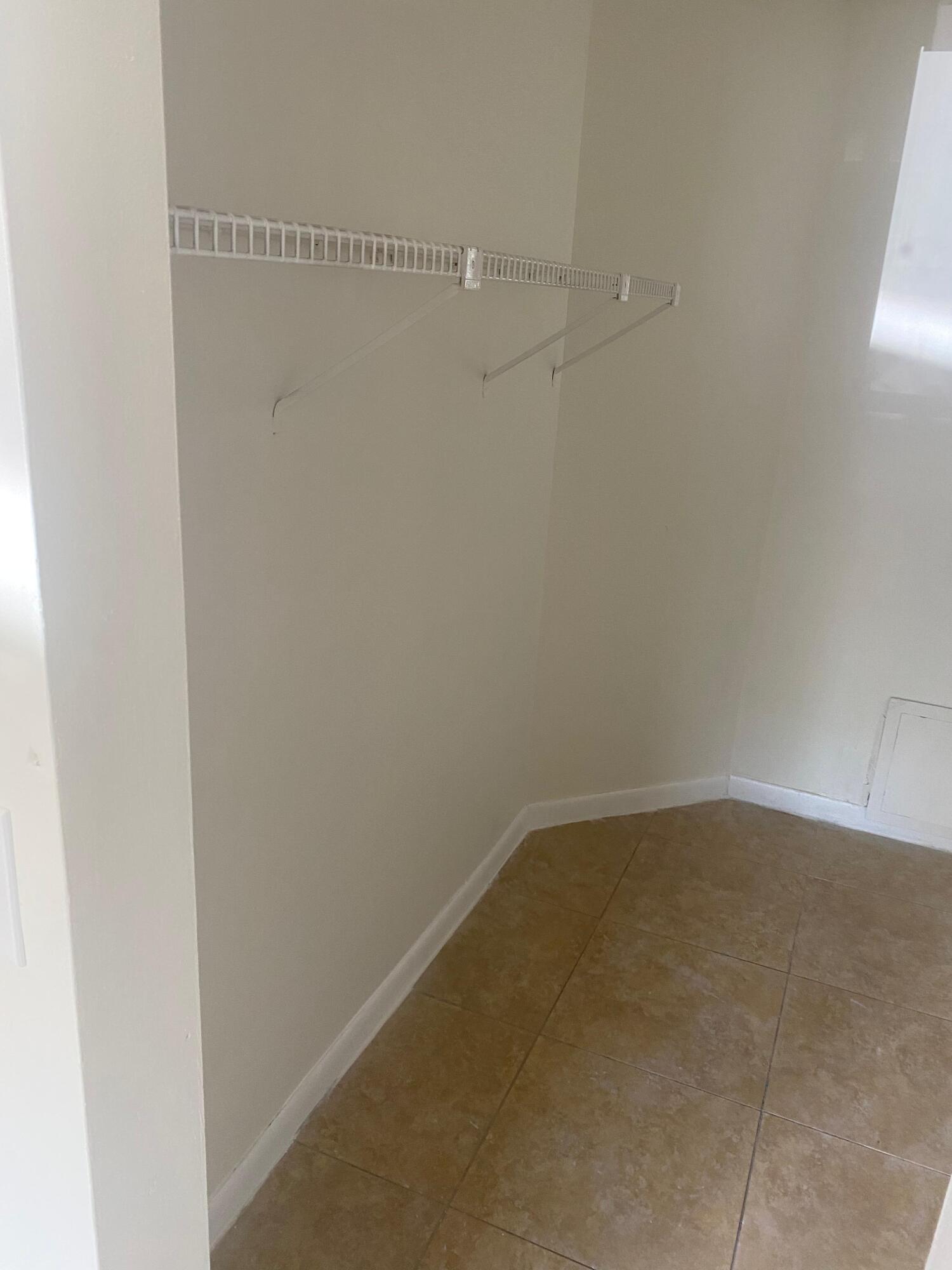 601 Lyons Road, Unit 7105 Coconut Creek, FL 33063 - Photo 9 of 13 a view of small space with racks on the wall