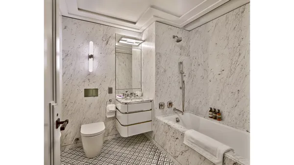 a kitchen with a sink and a mirror