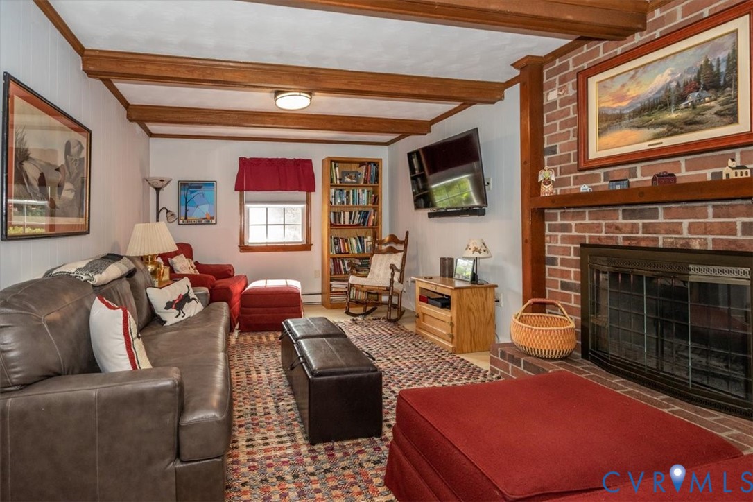 10712 Lunswood Road Chester, VA 23831 - Photo 11 of 31 Exposed wood beams, wood-trimmed windows and a bri