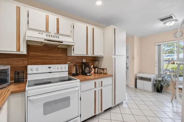 a view of a kitchen with appliances and cabinets