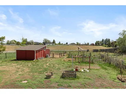 a view of a house with a yard and garage
