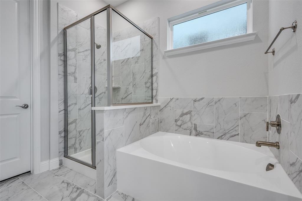 11764 Chartwell Court Frisco, TX 75035 - Photo 15 of 25 a bathroom with a white bath tub and shower