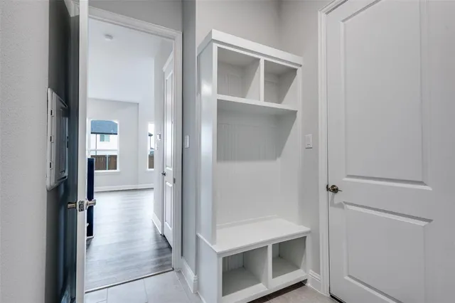 front view of a house with a large window