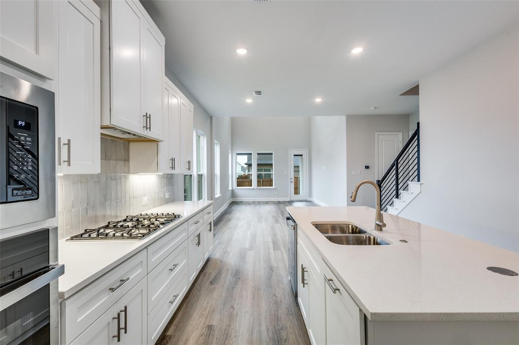 11764 Chartwell Court Frisco, TX 75035 - Photo 4 of 25 a kitchen with sink stove and refrigerator
