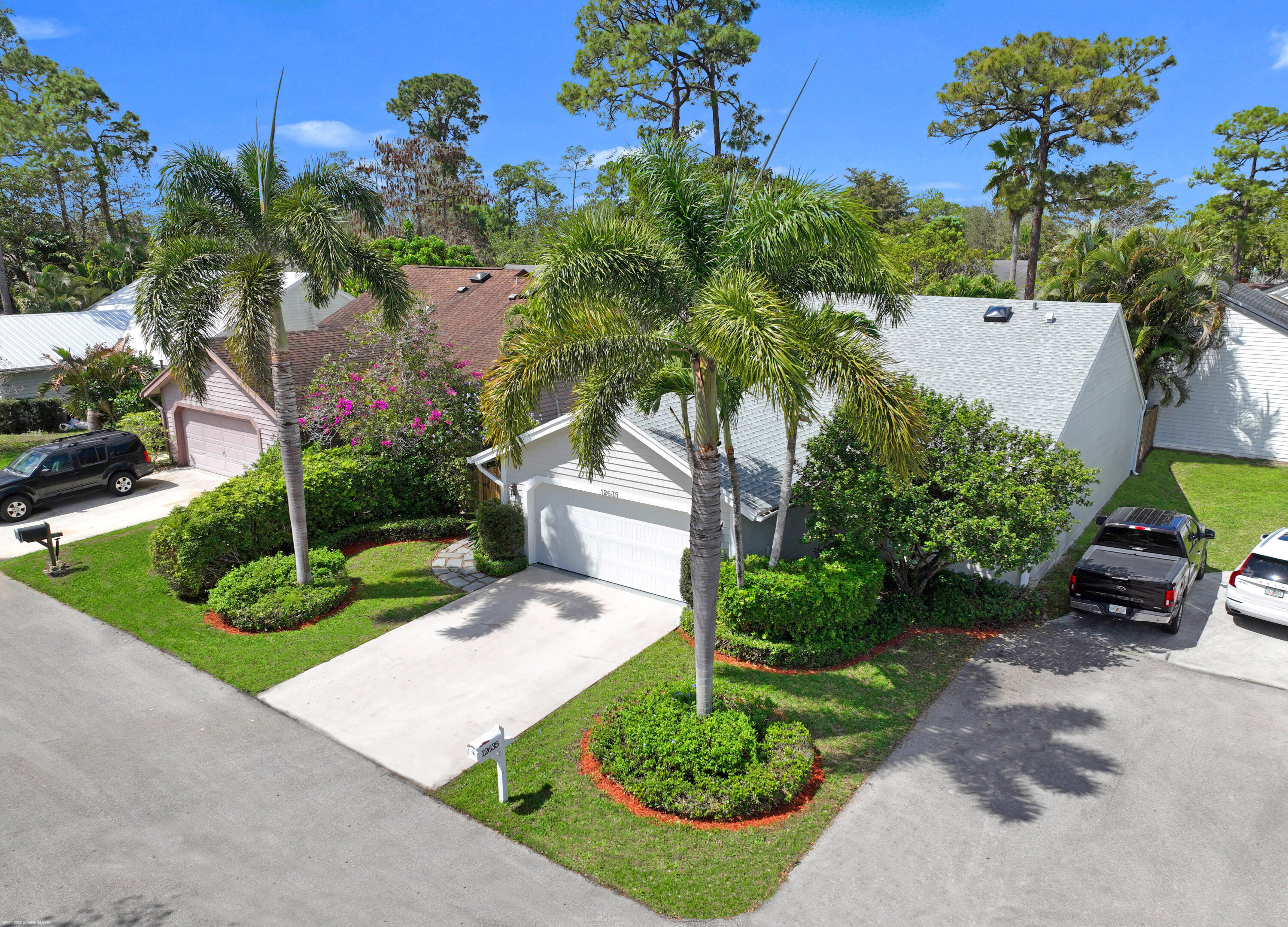 12635 Timber Ridge Circle Wellington, FL 33414 - Photo 1 of 33 a view of a garden with a bench in the garden
