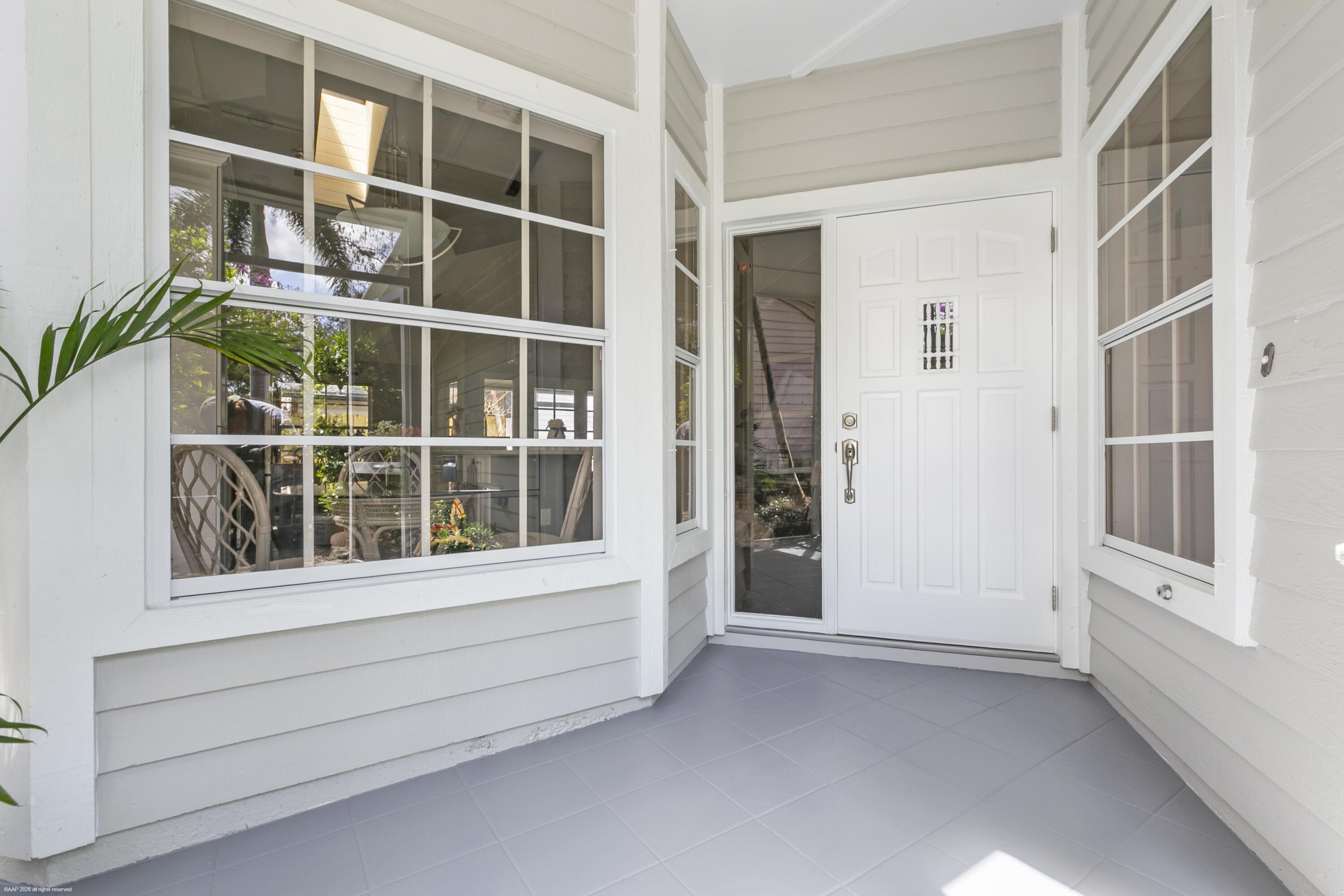 12635 Timber Ridge Circle Wellington, FL 33414 - Photo 5 of 33 a view of an entryway with a window