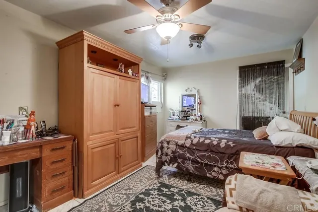 a bedroom with a bed and a couch