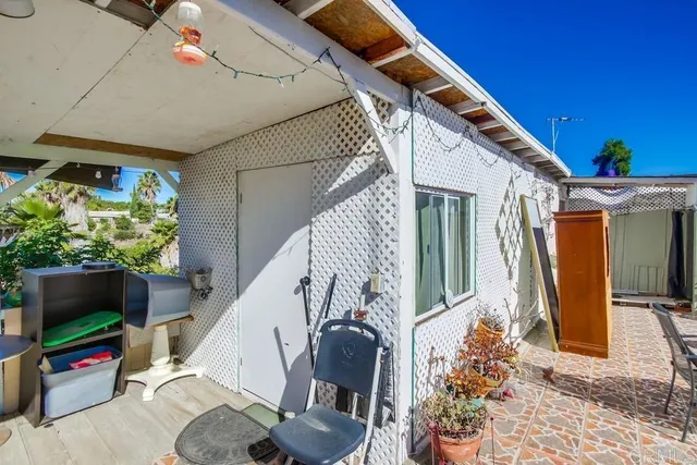 a view of a chairs and table in a backyard