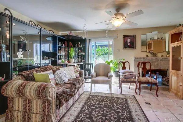 a living room with furniture and a rug