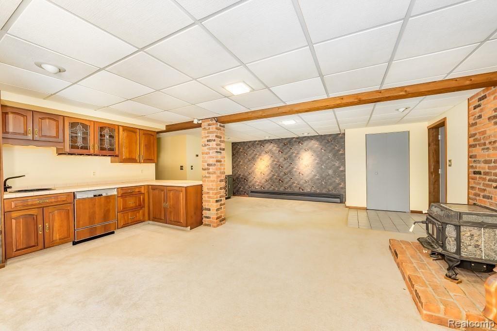 5180 Brady Road Howell, MI 48843 - Photo 20 of 29 Lower level walkout family room with kitchenette, plus additional space for rec area, etc
