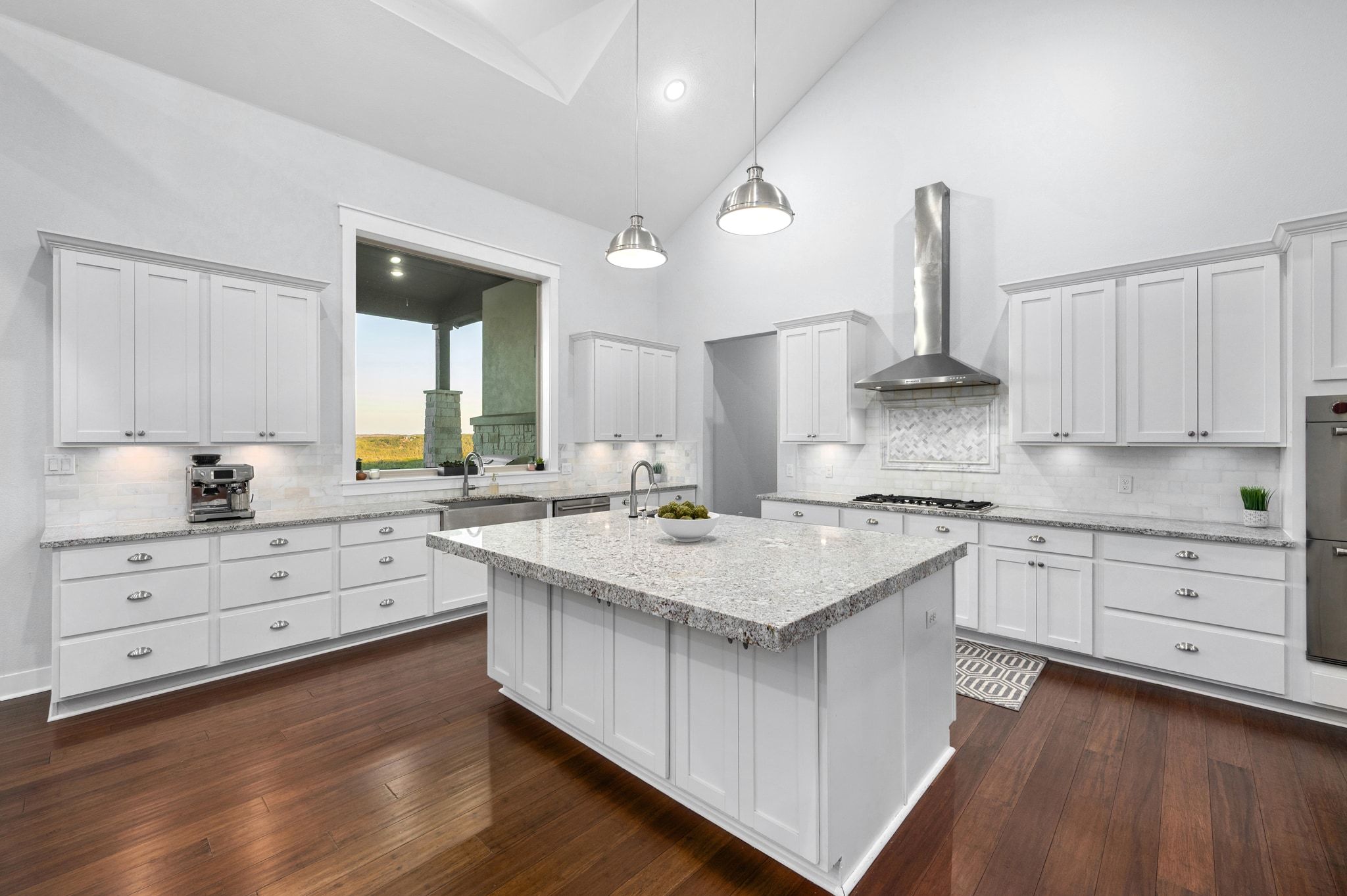 1821 Overland Stage Road Dripping Springs, TX 78620 - Photo 14 of 39 a kitchen with granite countertop white cabinets and white appliances